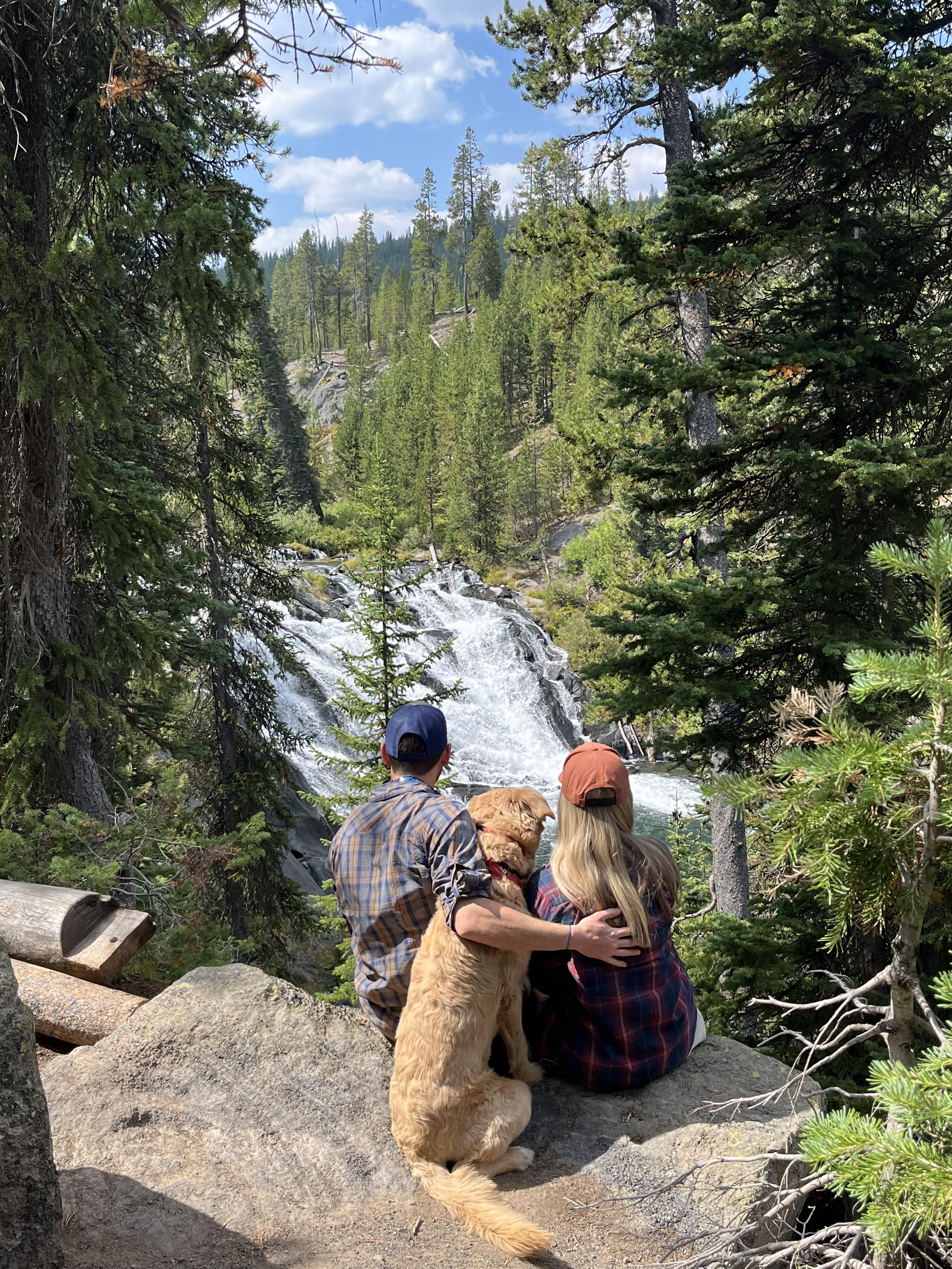 Alicia, Granger, and Archie at a waterfall